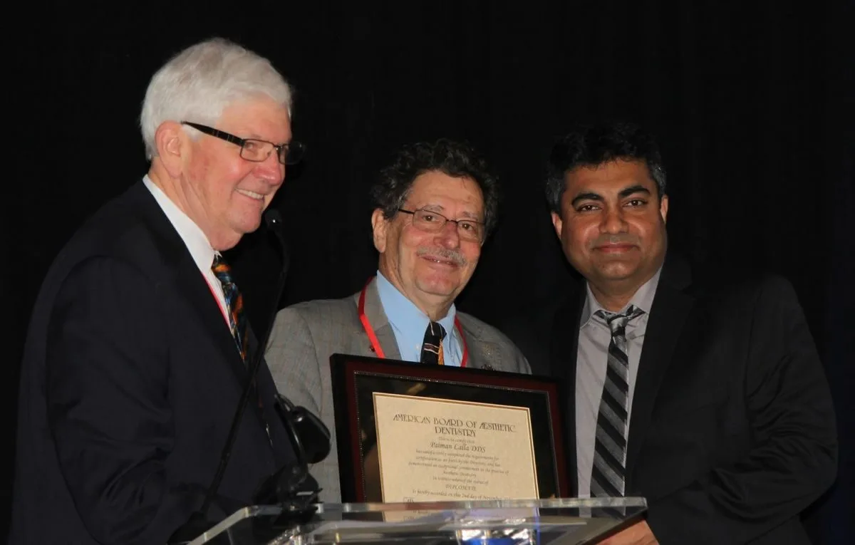 Dr. Lalla receiving his American Board of Aesthetic Dentistry Diplomate certificate