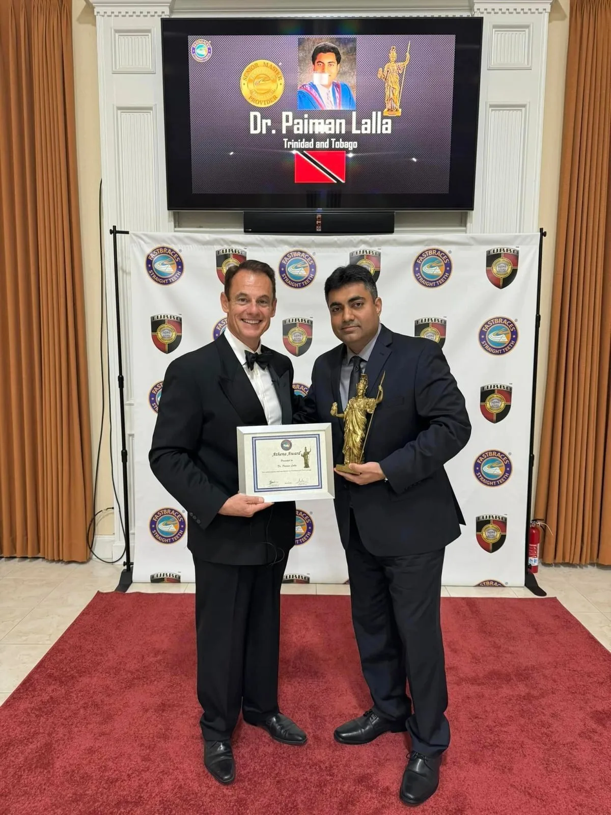Dr. Lalla receiving the FASTBRACES® Athena Award